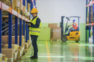 Wharehouse worker with clipboard